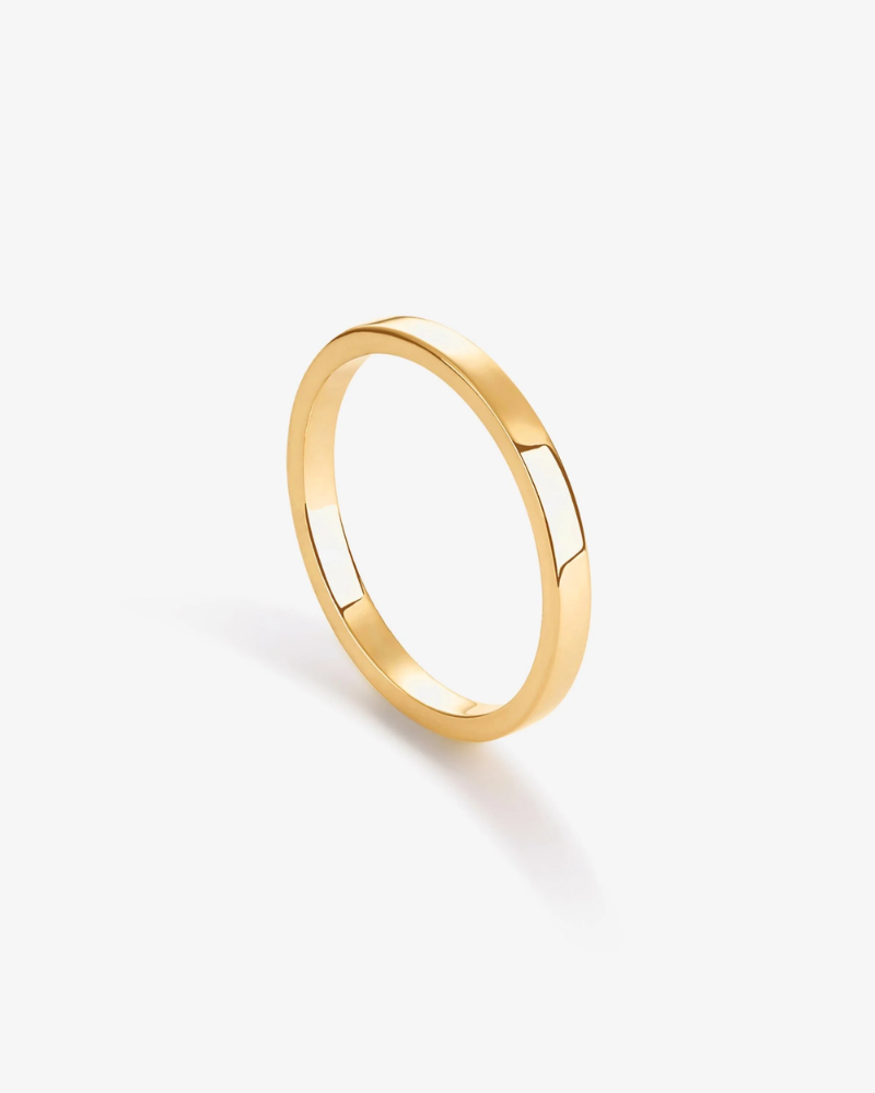 Gold ring on a white background