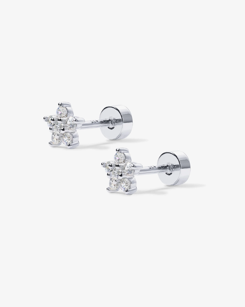 Pair of diamond stud earrings on a white background