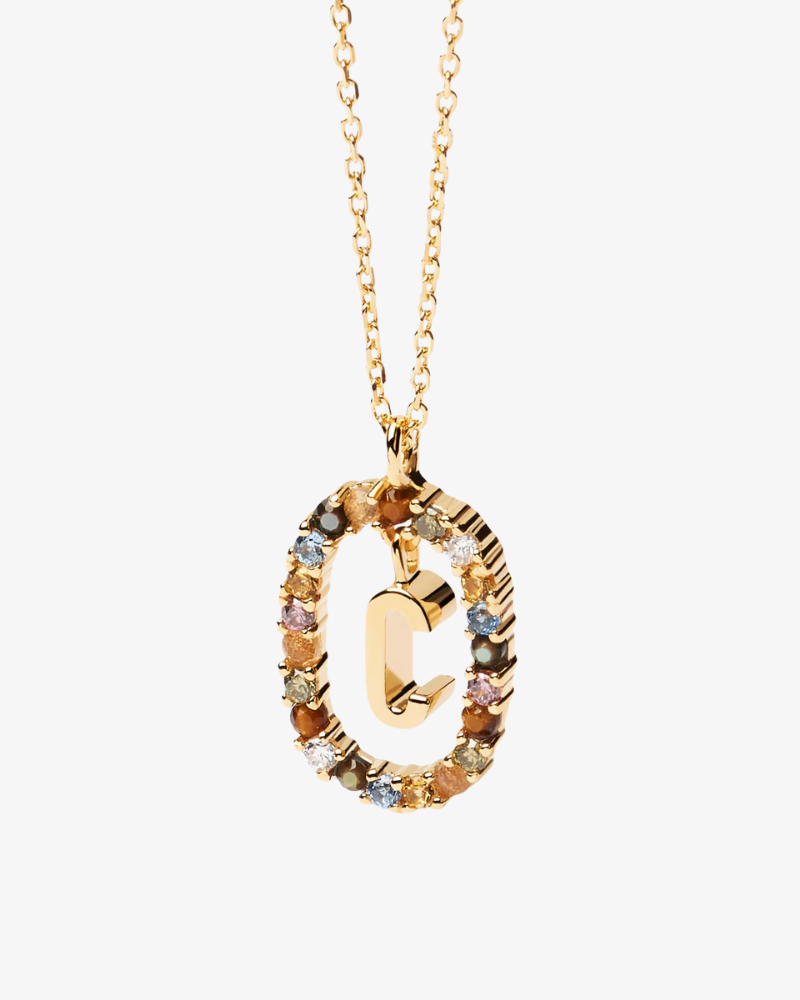 Gold necklace with a multicolored pendant on a white background