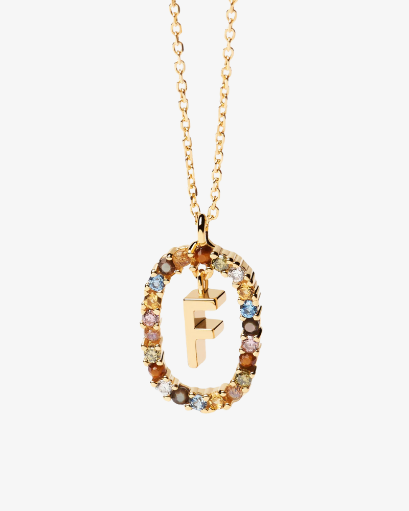 Gold necklace with a multicolored gemstone pendant featuring the letter 'F' on a white background