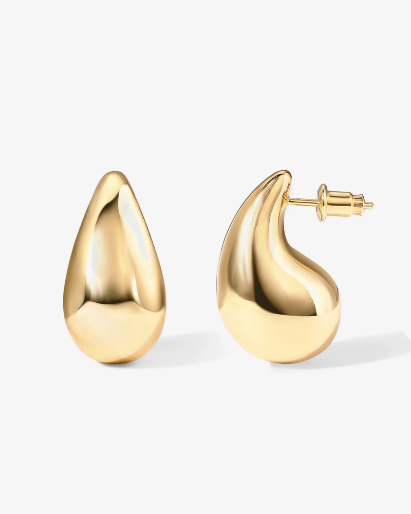 Gold hoop earrings on a white background