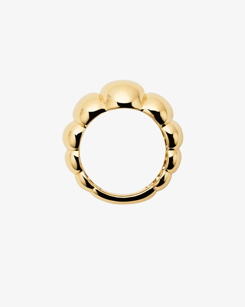 Gold ring with a unique design on a white background