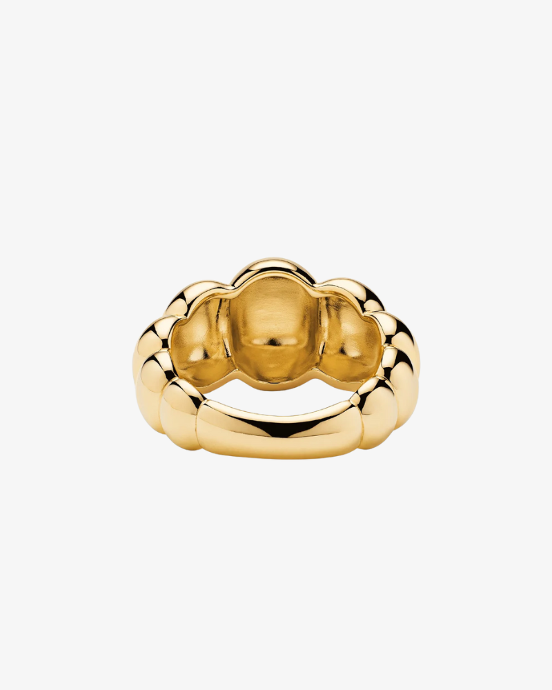 Gold ring with a unique design on a white background