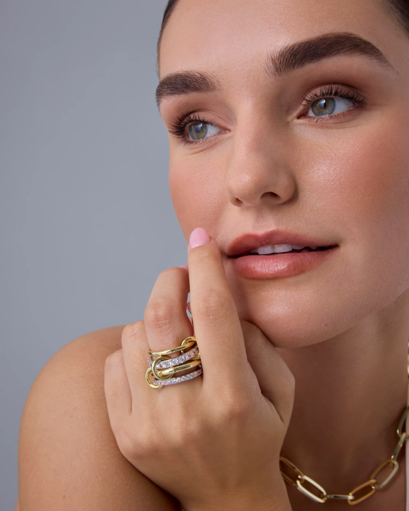 Model wearing chunky Interlocked Stackable Ring on index finger