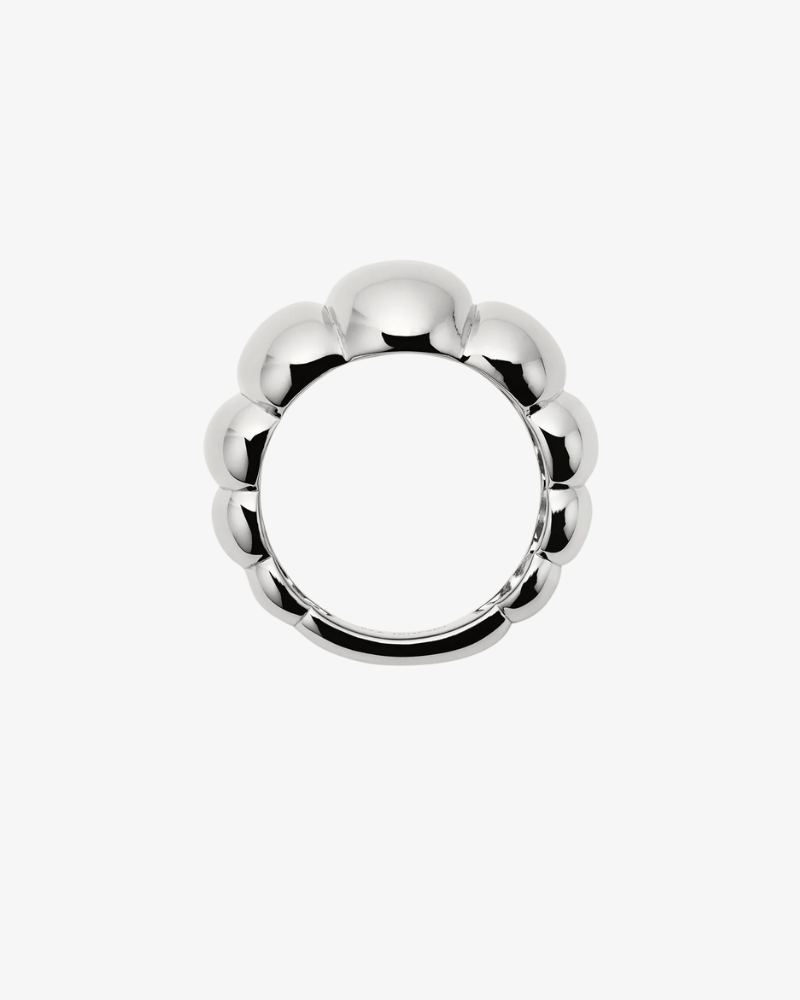 Silver ring with a unique design on a white background