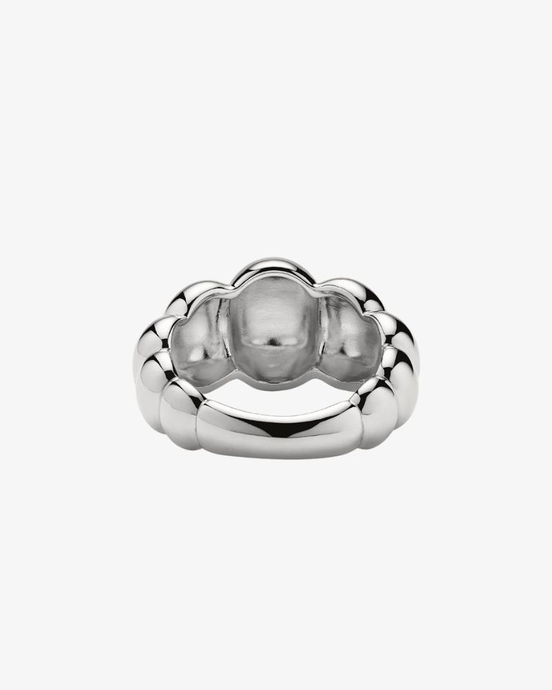 Silver ring with a unique design on a white background