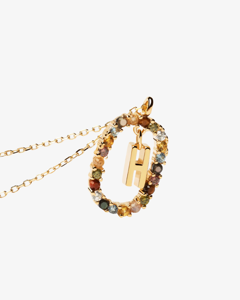 Necklace with a multicolored gemstone pendant on a white background
