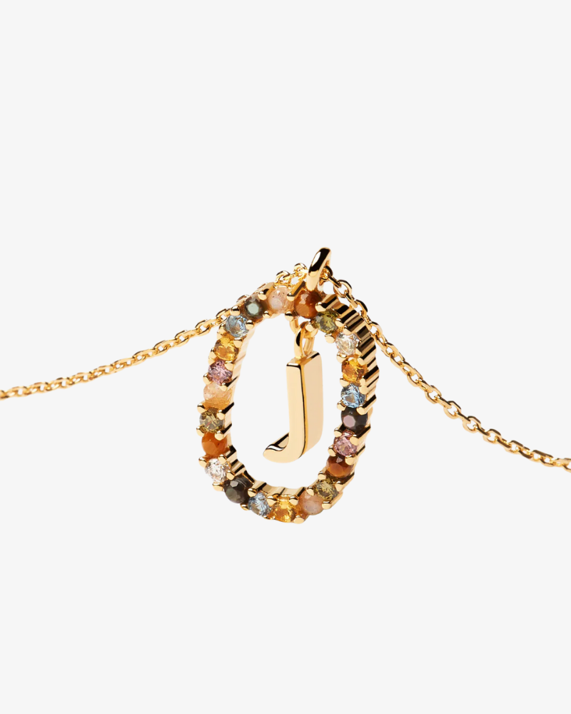 Gold necklace with a letter 'J' pendant on a white background