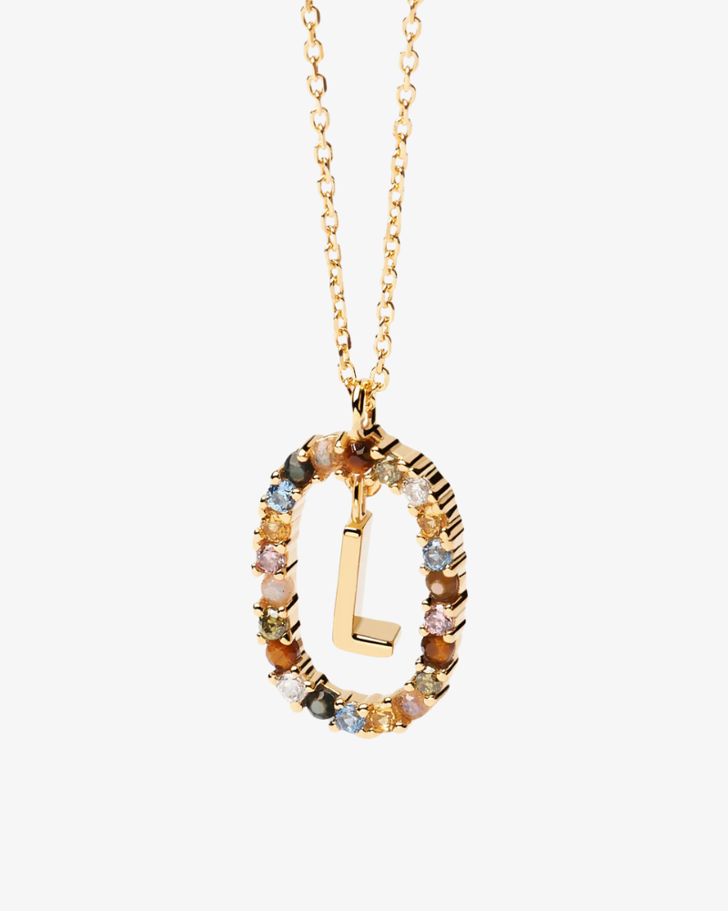 Gold necklace with a multicolored pendant on a white background
