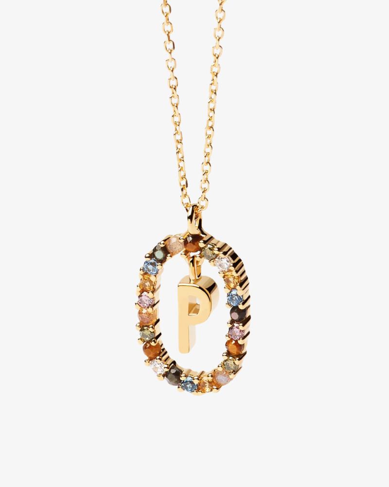 Gold necklace with a multicolored gemstone pendant on a white background