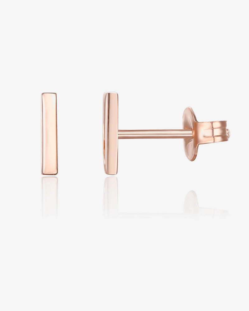 Rose gold bar-shaped earrings on a white background