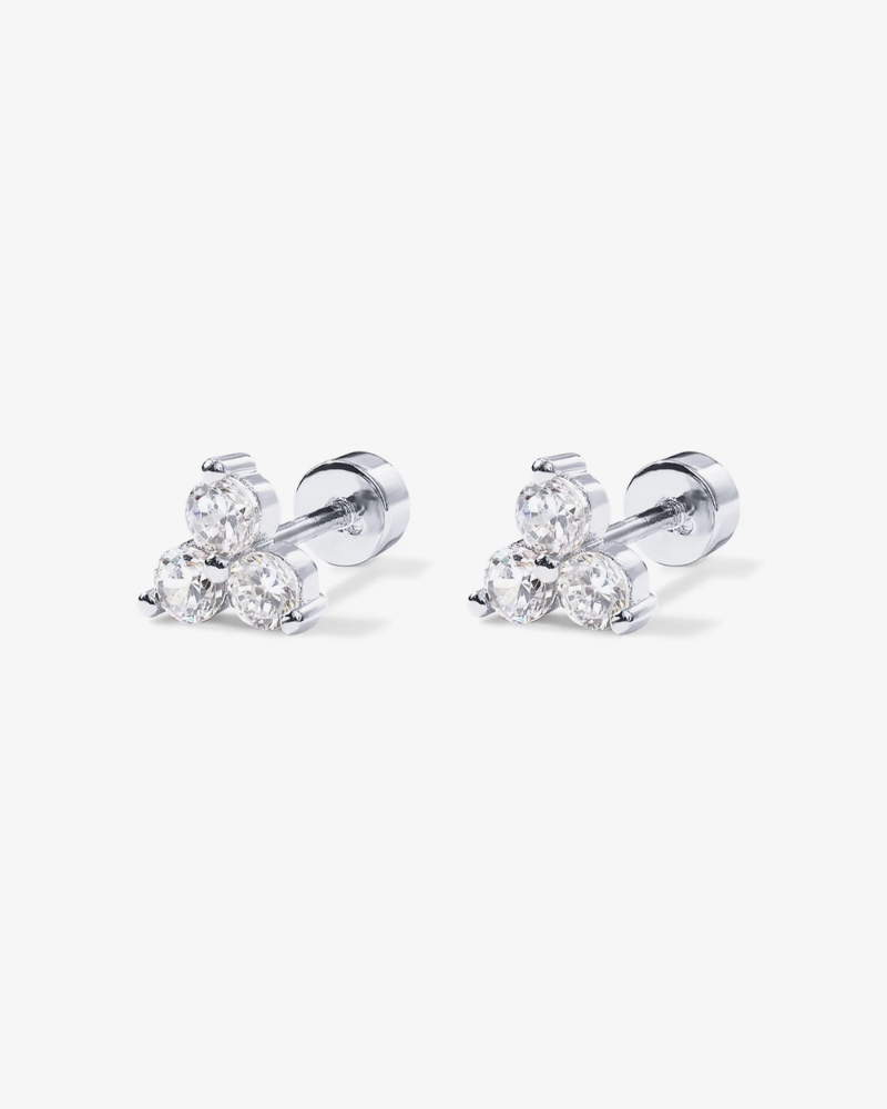 Pair of diamond stud earrings on a white background