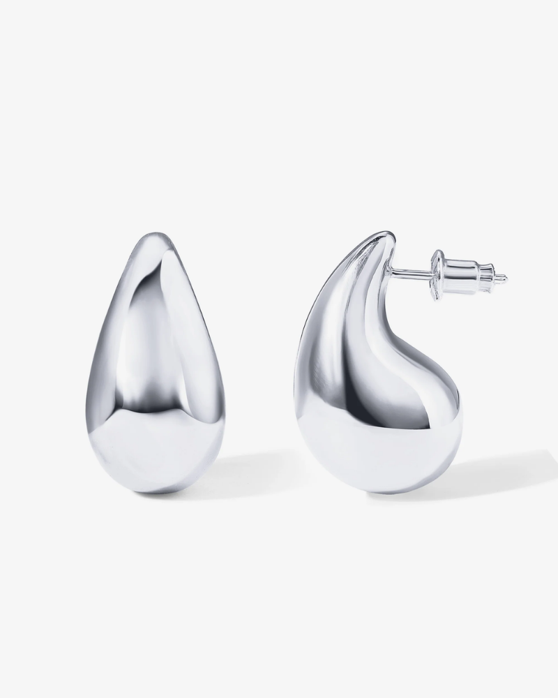 Pair of silver teardrop earrings on a white background