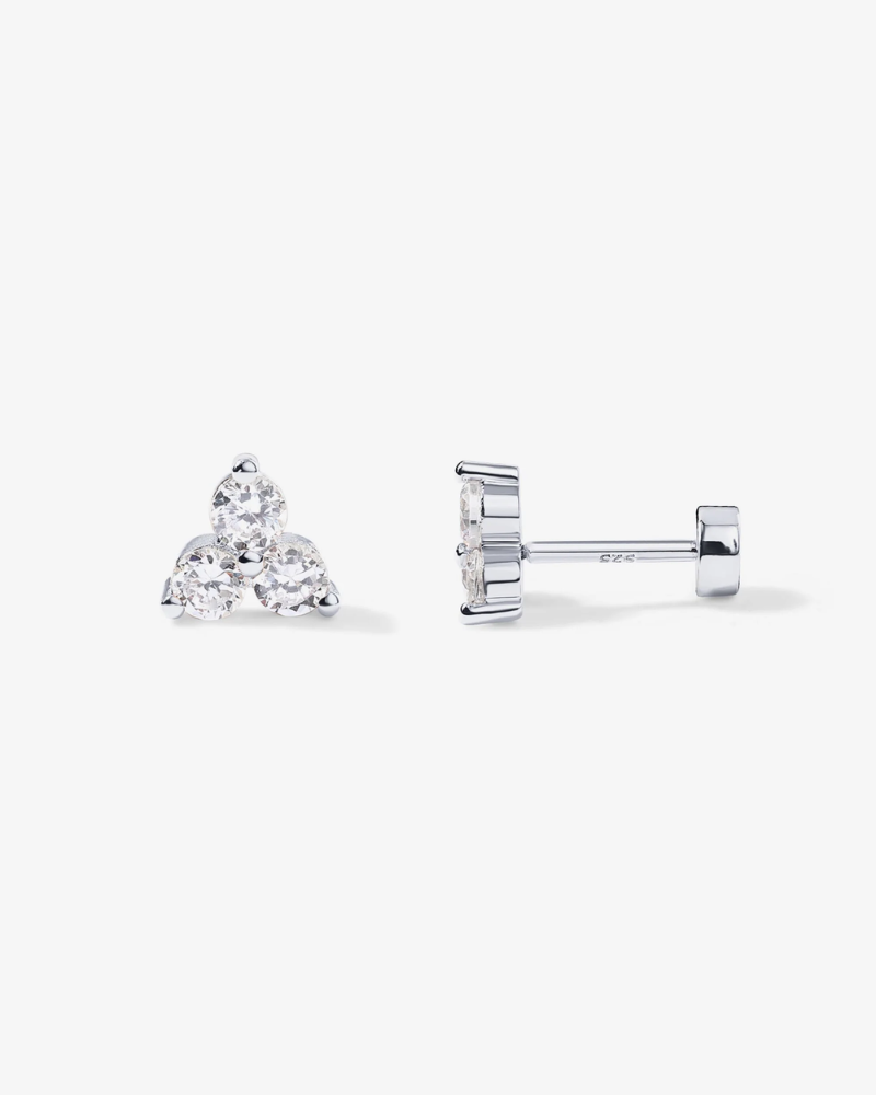 Pair of diamond stud earrings on a white background