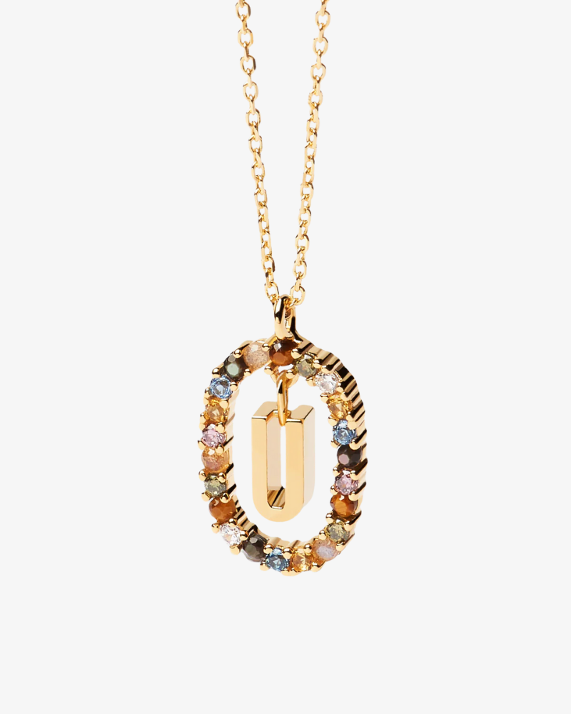 Gold necklace with a multicolored pendant on a white background